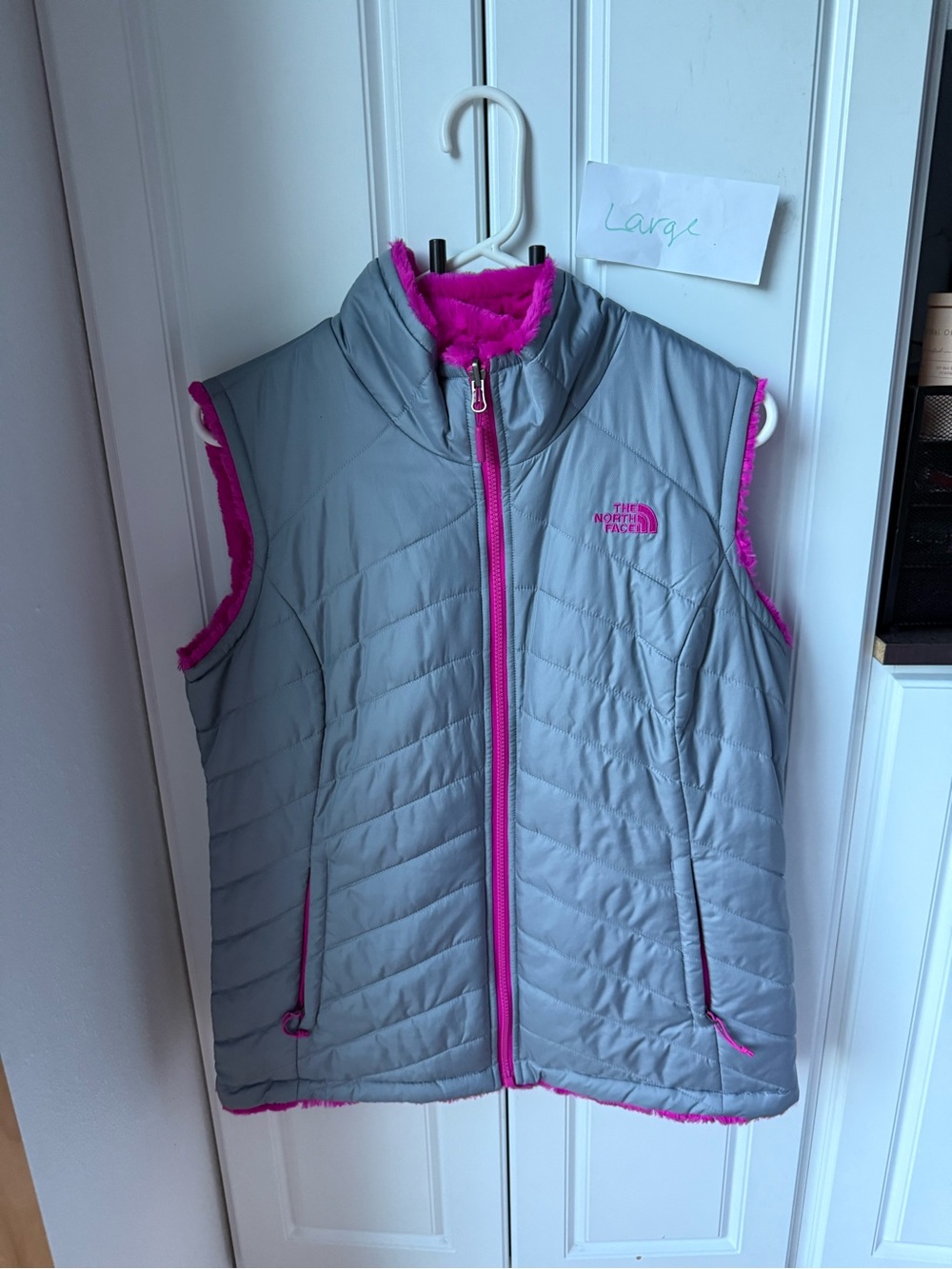 The North Face women’s large Gray & fushia Insulated Reversible Vest, (i2)